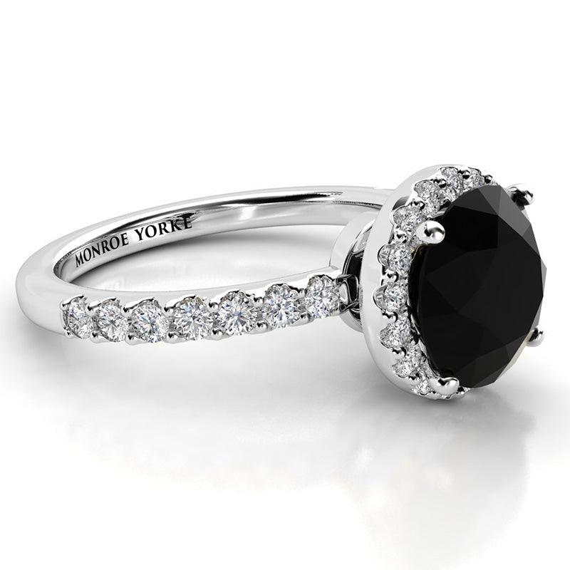 Black diamond ring with a unique white Diamond halo. white gold 