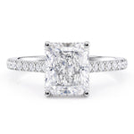Radiant cut diamond engagement ring with a hidden halo of diamonds and diamonds on the sweep up band