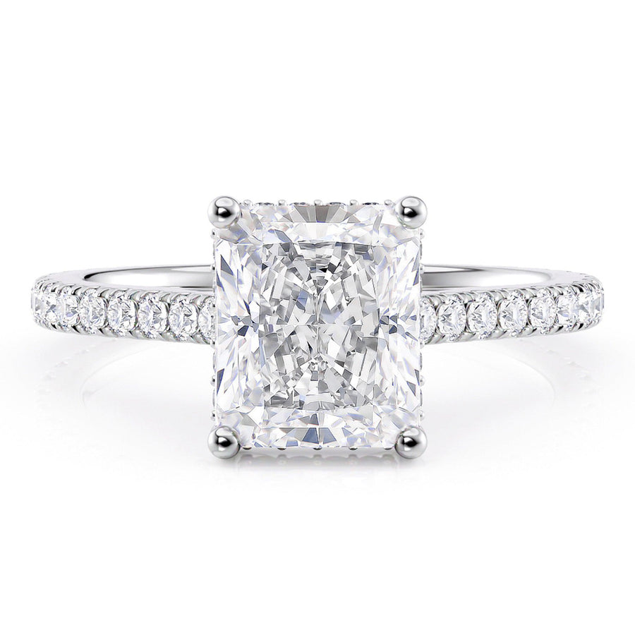 Radiant cut diamond engagement ring with a hidden halo of diamonds and diamonds on the sweep up band