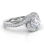 Side view showing the unique halo that wraps the centre round diamond. Tempest, created in platinum. 