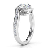 Side view 2 showing the unique halo that wraps the centre round diamond. Tempest, created in platinum. 