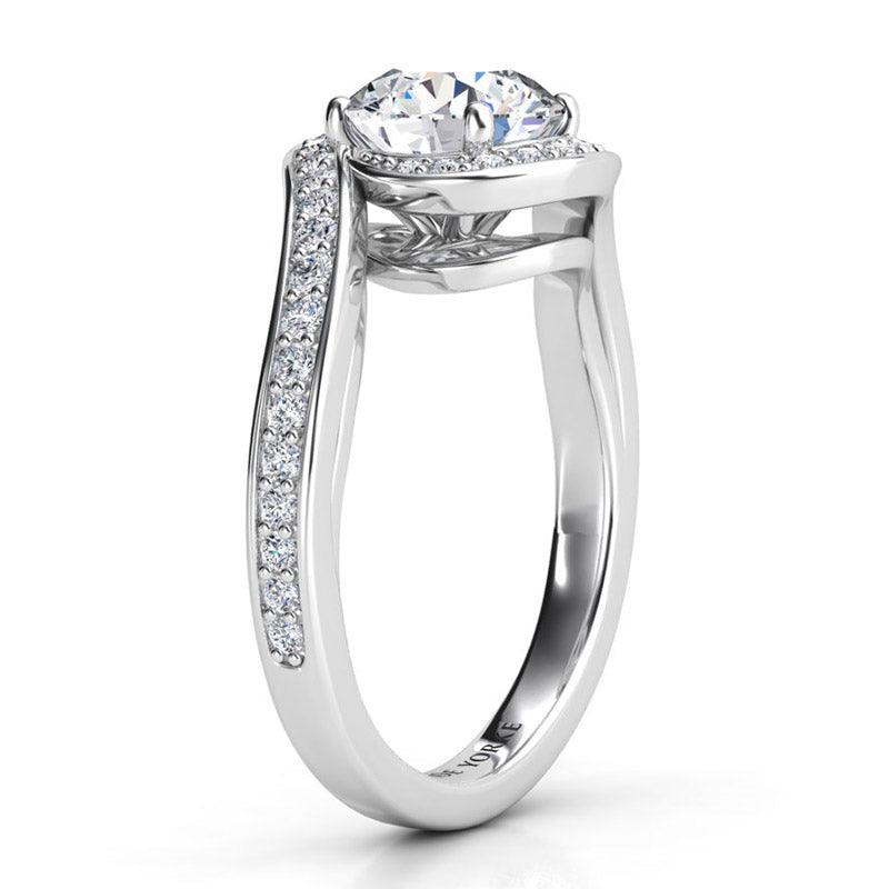 Side view 2 showing the unique halo that wraps the centre round diamond. Tempest, created in platinum. 