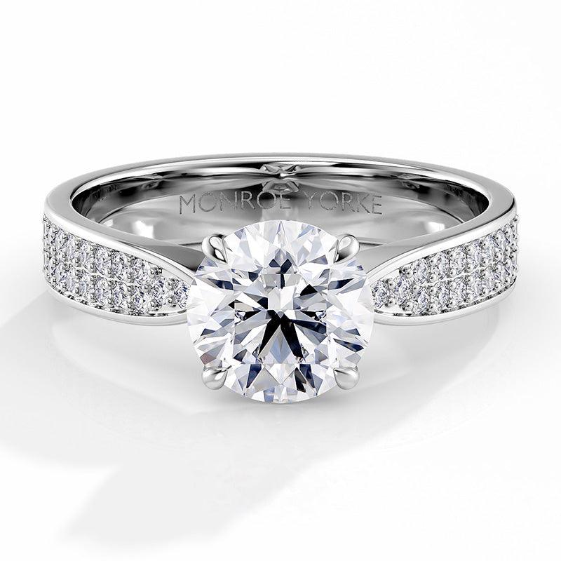 Sophia - Engagement ring, centre round brilliant cut diamond in a 4 claw setting. Pave set diamonds on the band. 