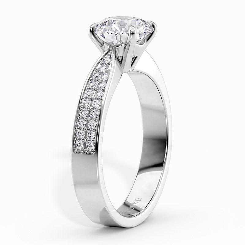 Sophia Platinum - Engagement ring, side view showing the beautiful detail of the centre setting and pave set diamonds on the band. 