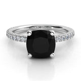 Storm - Top view. Cushion cut black diamond ring in 18ct white gold.  White diamond highlights on the band.  