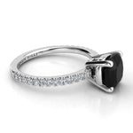 Storm - Side view showing centre cushion cut black diamond in a basket setting.  White diamonds down the band. 