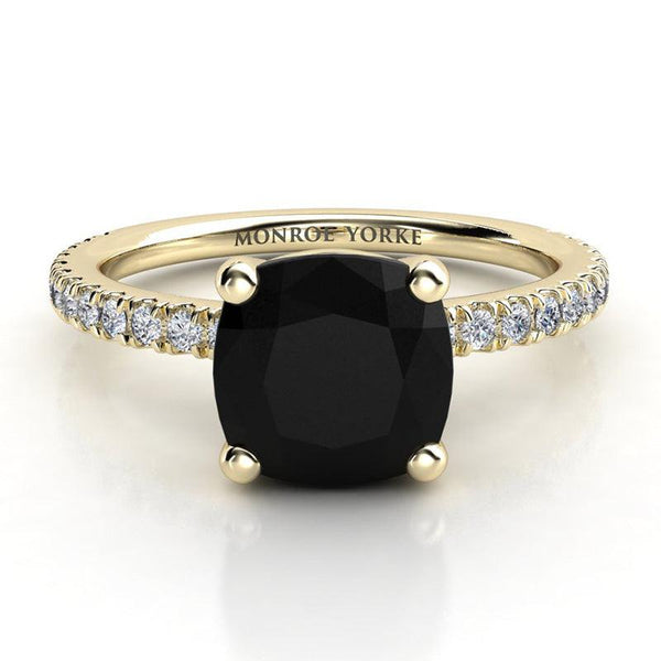 Storm - Gold, cushion cut black diamond ring. Centre 4 claw basket setting.  Diamond set band. Top view