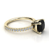 Storm - Yellow Gold. Side view showing centre 4 claw basket setting and diamond set band. 