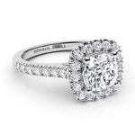 Summer in platinum - side view showing diamond halo surrounding the cushion cut diamond and diamond on the sweep up band