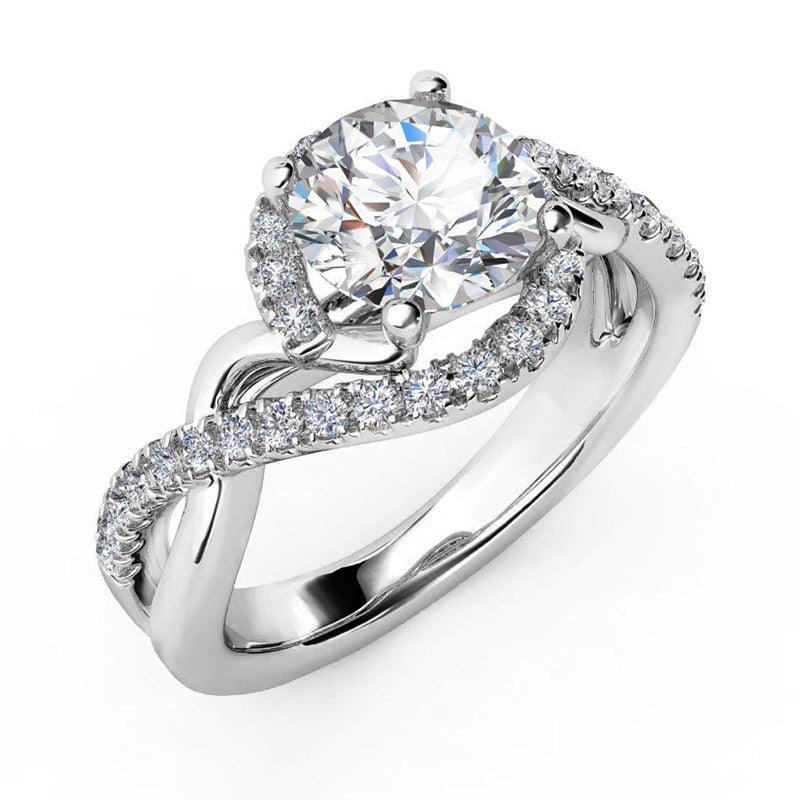 Tessa - Unique halo ring.  Round diamond centre, with a twist band.  White gold 