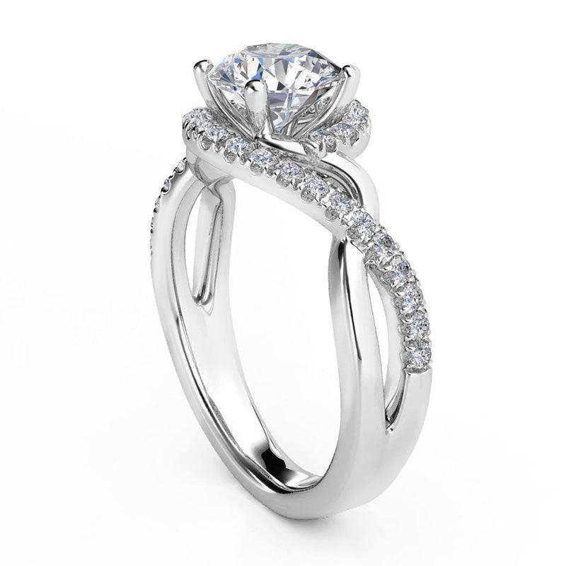 Tessa - Unique halo diamond ring.  Round centre diamond. Side view showing the twisting band — view 3
