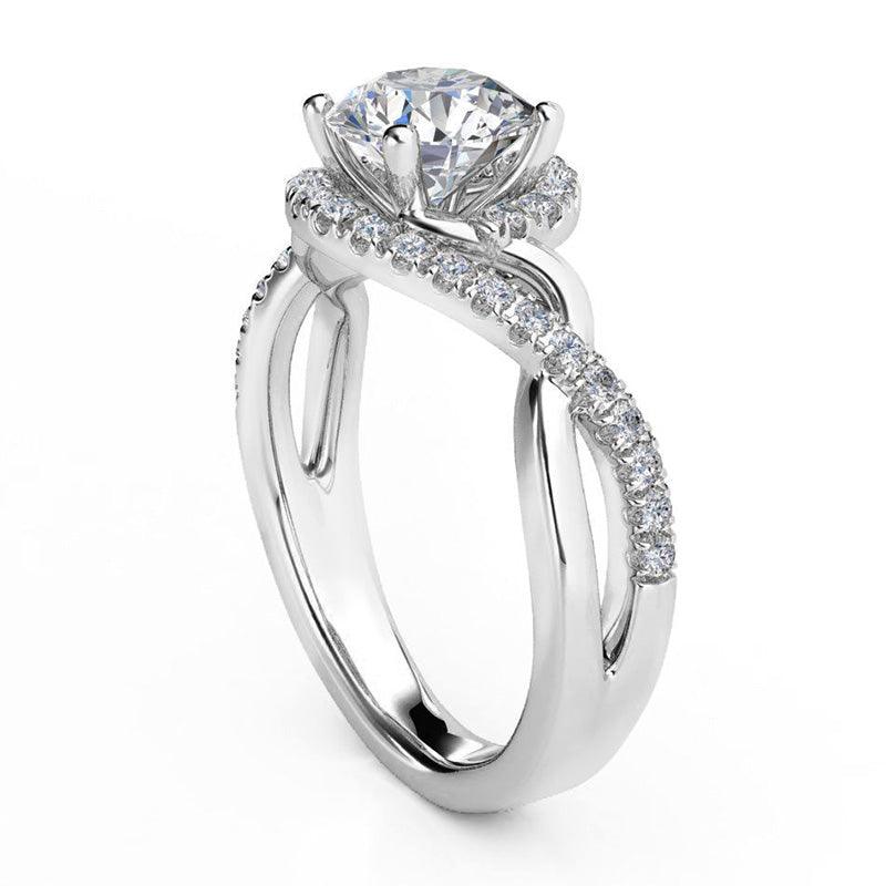 Tessa in platinum - Unique halo diamond ring.  Side view showing the twisting band
