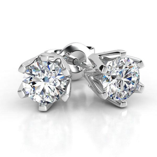 Diamond stud earrings in white gold, six claw setting. Round diamonds. Total 0.20 carats 