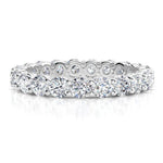 Venus - diamond wedding or eternity ring with diamonds all the way around the band.  White gold or platinum, 1.00 carats. 