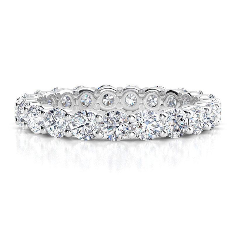 Venus - diamond wedding or eternity ring with diamonds all the way around the band.  White gold or platinum, 1.00 carats. 