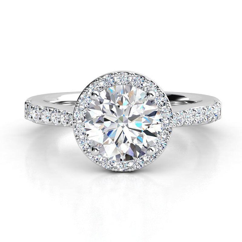 Victoria in Platinum - round diamond halo engagement ring with diamonds on the band and under the main diamond. 