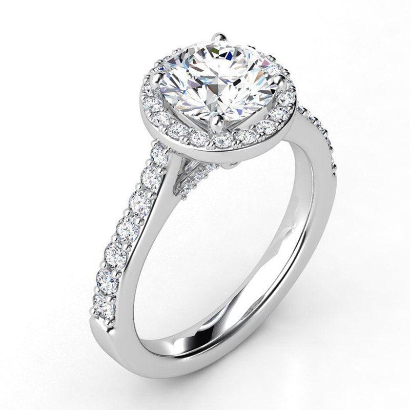 Victoria side view - round diamond halo engagement ring with diamonds on the band. 18ct white gold — view 3