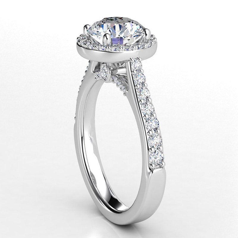 Victoria - round diamond halo engagement ring.  Diamond highlights on the under-rail. 18ct white gold — view 4