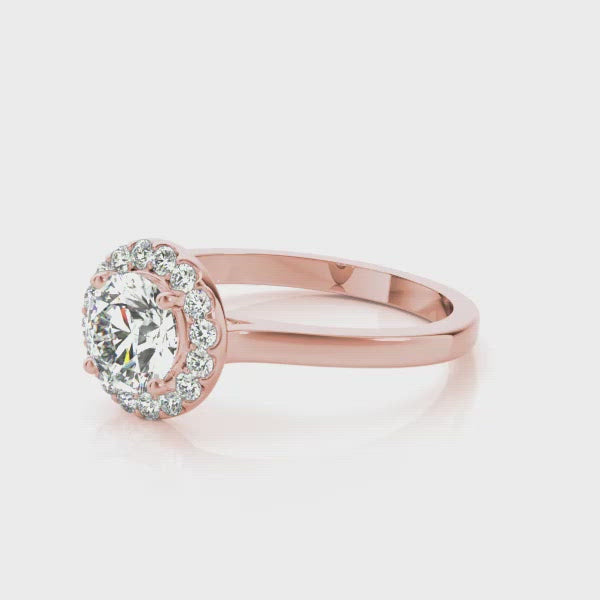 A classic diamond halo design is taken to a higher level, literally. This engagement ring design showcases a beautiful round brilliant cut diamond that is surrounded by a gleaming halo of diamond accents. The stone and the halo are elevated above the band for all the world to see. This magnificent piece will be an ideal match for any of our wedding bands for a reminder of your eternal love.