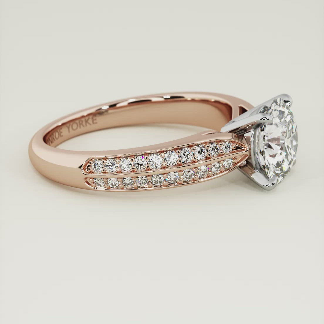 The beauty of a round brilliant cut diamond enhanced on this stunning engagement ring setting
