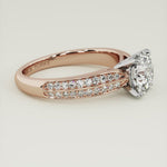 The beauty of a round brilliant cut diamond enhanced on this stunning engagement ring setting